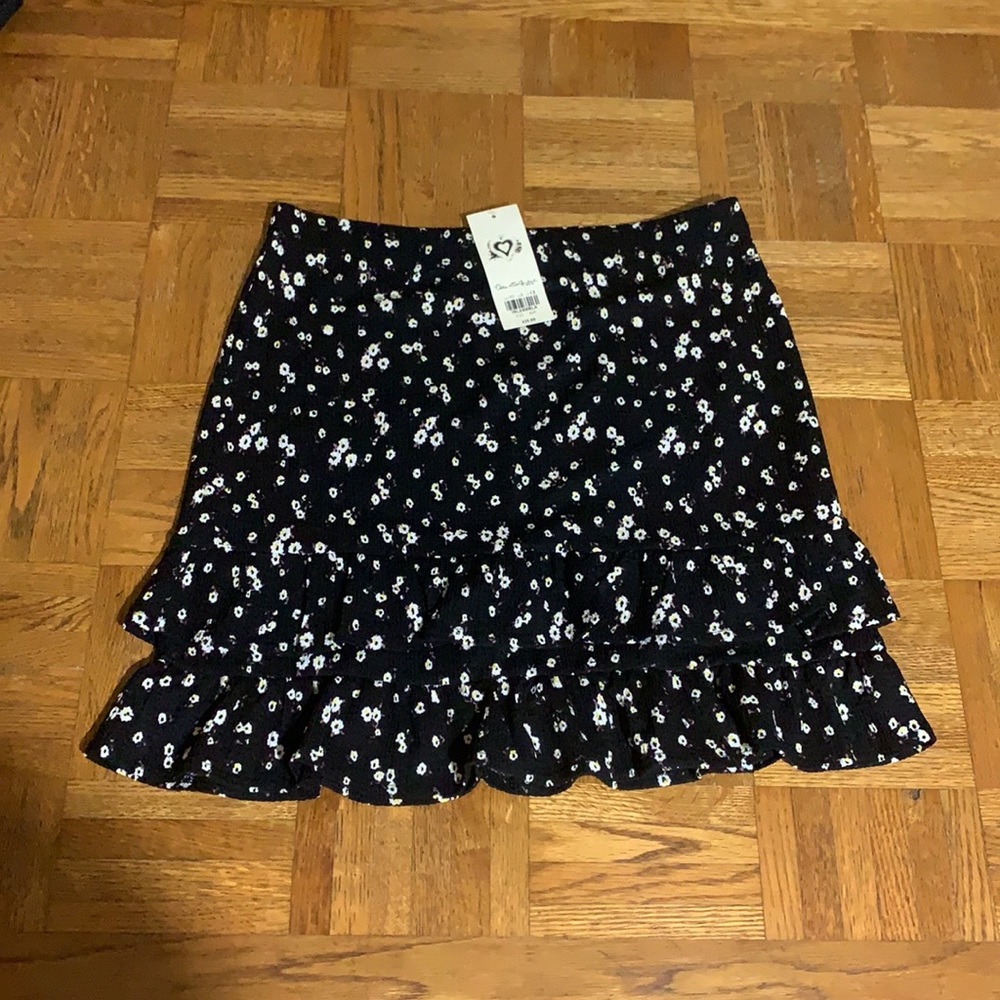 Black with little white flowers and ruffles on bottom